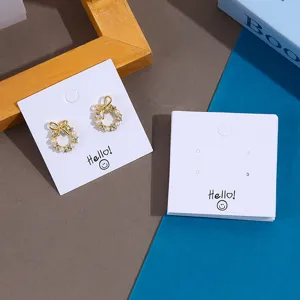 Cute bow pearl stud earrings set with hello smile white display cards for jewelry packaging.