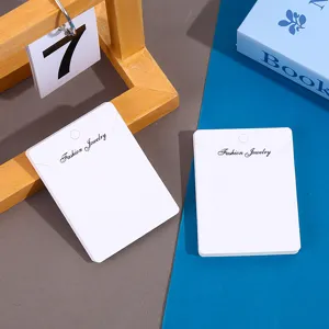 White necklace display cards, minimalist earring packaging paper for retail jewelry.