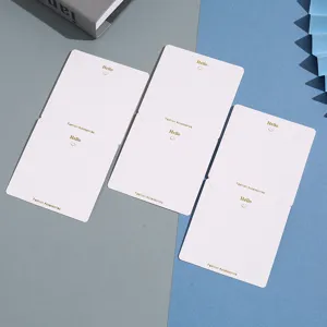 White paper jewelry display cards with gold foil hello smile logo for necklace and earrings.