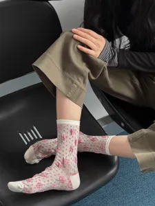 Retro cherry mid-calf knit socks with floral embossed texture and vintage style design.
