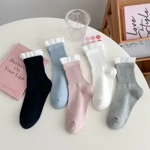 Comfortable solid color mid-tube socks featuring sweet white pleated ruffle cuffs for daily wear.