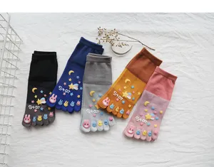 Detailed view of women cotton five toe socks with cute cartoon rabbit prints and star text.
