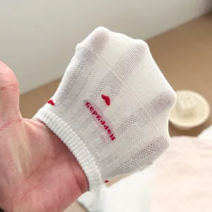 Women summer breathable striped mesh invisible boat socks with cute red embroidery details.