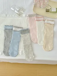 Japanese style women crew socks with double lettuce edge, cute cream colors, soft cotton detail.