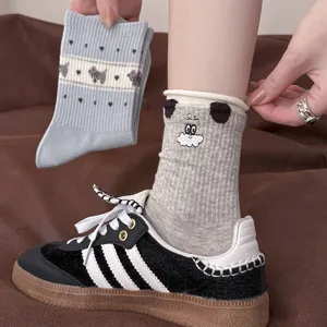 Women's grey cotton mid-tube socks featuring cute cartoon embroidery designs, soft and versatile.