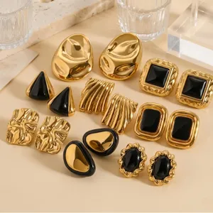 Close-up details of vintage gold and black geometric stainless steel earrings set for women.