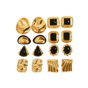Close-up details of vintage gold and black stainless steel irregular textured geometric fashion earrings.