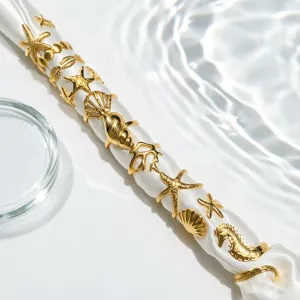 Conjunto de anillos abiertos de estrella de mar y concha de acero dorado, estilo vacacional.