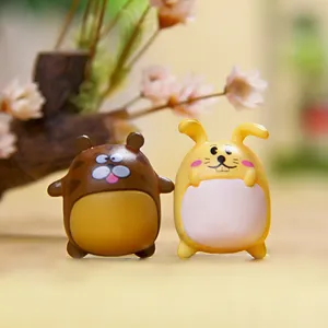 Cute cartoon couple resin miniature toy figurines close up shot, vibrant colors and smooth details.