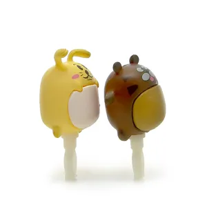 Detailed close-up shot of cute cartoon animal dust plugs featuring lovely rabbit and bear designs.