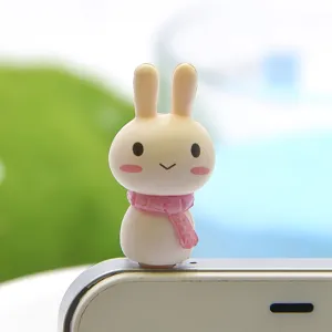 Cute rabbit dust plug detail view, adorable pink scarf design for phone accessories.