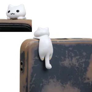 Cute white cat hanging figurine phone dust plug, adorable cartoon headphone jack accessory.