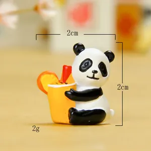 Cute miniature panda resin figurine holding an orange juice drink for garden micro landscape decor.