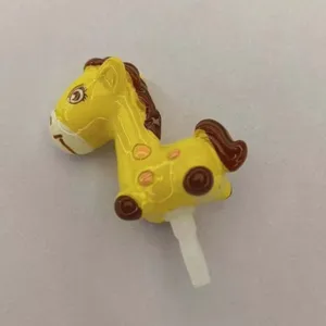 Detailed view of cute cartoon spotted horse 3.5mm headphone jack dust plug for phone audio.