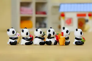 Cute miniature panda figurines holding food, perfect for succulent pots and micro landscape decor.
