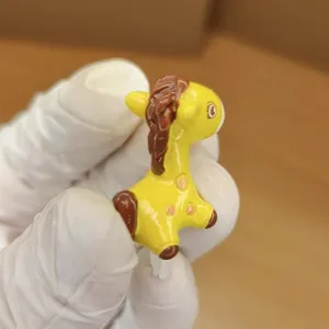 Detailed view of the cute cartoon spotted pony dust plug accessory, shown in close-up.
