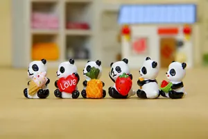 Cute miniature panda figurines holding foods like ice cream and strawberry for garden decor.