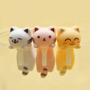 Close-up detail of cute cat hanging figurines, adorable multi-color mini cat charm set for decor