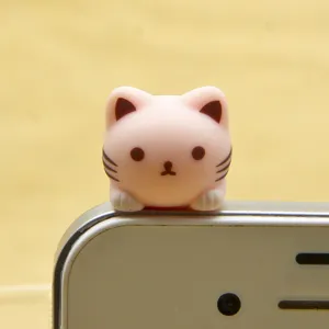 Cute pink cat phone dust plug detail shot, adorable cartoon kitty accessory for smartphone users.
