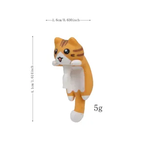 Cute orange tabby cat phone dust plug, resin hanging cat charm, small decorative accessory.