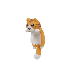 Cute orange cat figurine detail, cartoon style phone charm or dust plug decoration.
