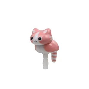Detailed view of the cute pink cat phone dust plug, featuring a cute crouching design.
