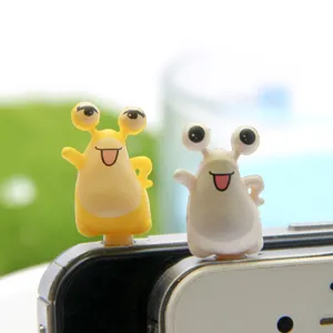 Cute cartoon monster slug design 3.5mm headphone jack dust plug close up detail shot