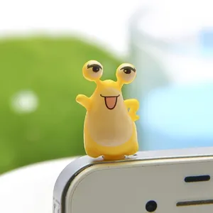 Cute cartoon big eye monster phone dust plug 3.5mm headphone jack accessory detail view.