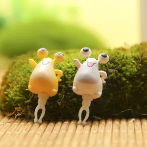 Cute big eye monster 3.5mm dust plug detail view, perfect phone accessory for couple items.