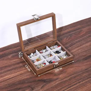 Houten sieradenopbergdoos detailgezicht met glazen deksel en zachte fluwelen vakjes.