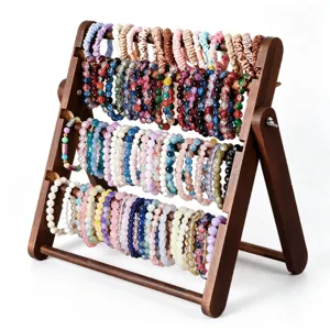 Wooden multi-tier jewelry display stand for scrunchies, bracelets and hair accessories.