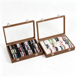 Hölzerne Schmuck-Aufbewahrungsbox mit 12 Fächern, Glasdeckel und Kissen für Armbänder.