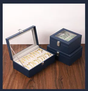 Vista detallada de la caja de almacenamiento de pulseras de cuero azul con tapa transparente.