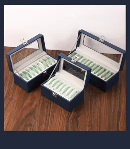 Caja de almacenamiento de cuero azul para pulseras de jade con tapa transparente elegante.