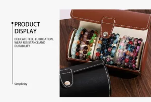 Close-up detail of cylindrical leather bracelet storage box displaying colorful crackle bead bracelets