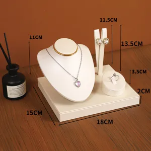 PU leather jewelry display stand set with necklace bust, earring holder, and ring tray.