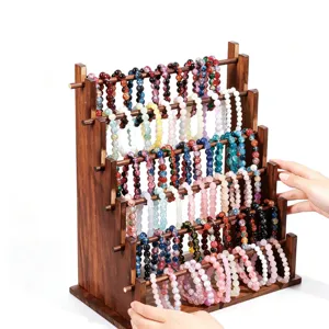 Présentoir à bijoux en bois à plusieurs niveaux pour bracelets, perles et accessoires.