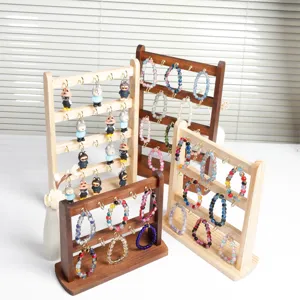 Espositore per gioielli in legno massello con ganci per portachiavi, bracciali e piccoli accessori.