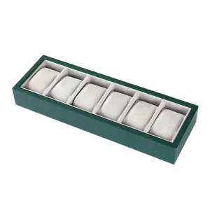 Green 6 slot watch display tray with soft grey velvet pillows for luxury watch storage box.
