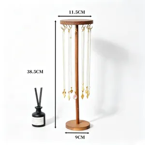 Wooden rotating necklace display stand and jewelry organizer with dimensional details.