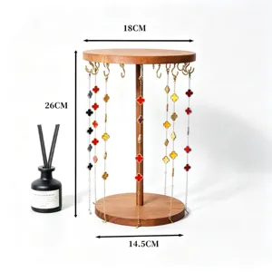 Solid wood circular jewelry display stand, necklace and bracelet hanging rack detail view.