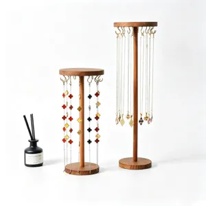 Wooden jewelry display stand with hooks for necklaces and bracelets, elegant desktop organizer.