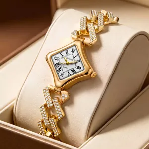 Orologio al quarzo da donna di lusso con numeri romani e cinturino a catena dorata.