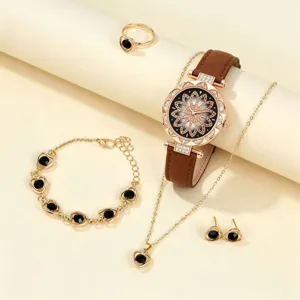 Elegant women watch jewelry set with vintage quartz watch, necklace, bracelet, and earrings.