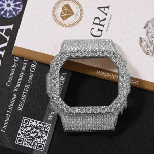 Detailed close-up of iced out square metal watch case bezel replacement, sparkling stone finish.