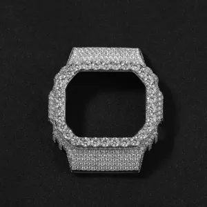 Closeup detail of square metal watch protective case fully paved with sparkling rhinestones.