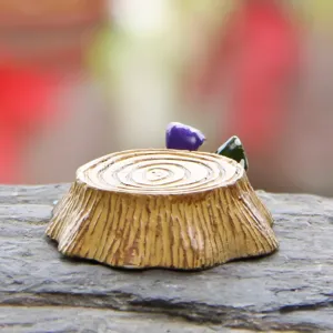 Resin miniature tree stump detail, macro shot of micro landscape decoration ornament.
