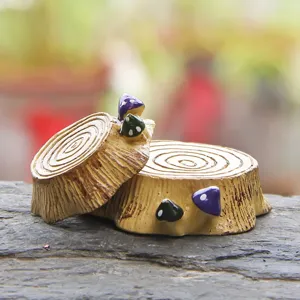 Miniature resin tree stump with cute colorful mushrooms for micro landscape decor and diy crafts.
