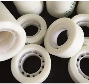 Close-up detail of clear invisible adhesive tape rolls, transparent traceless wedding car tape.