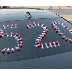 Detail view of clear strong suction cups used for wedding car lollipop decorations and floral displays.